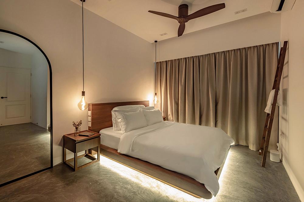 Scandinavian Bedroom with Cement Floor and Mirror