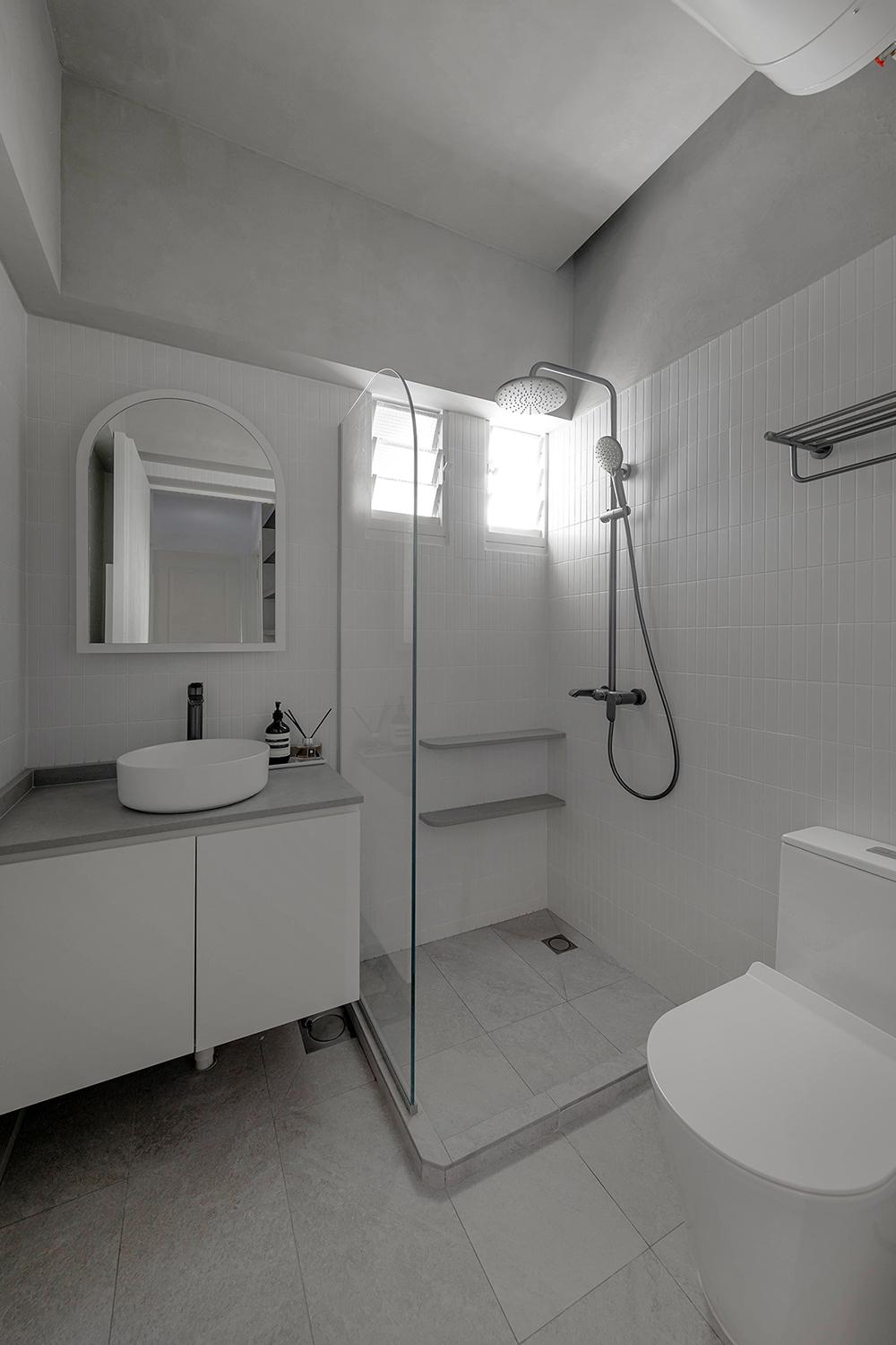 Scandinavian Bathroom with Homogeneous Tiles and Mirror