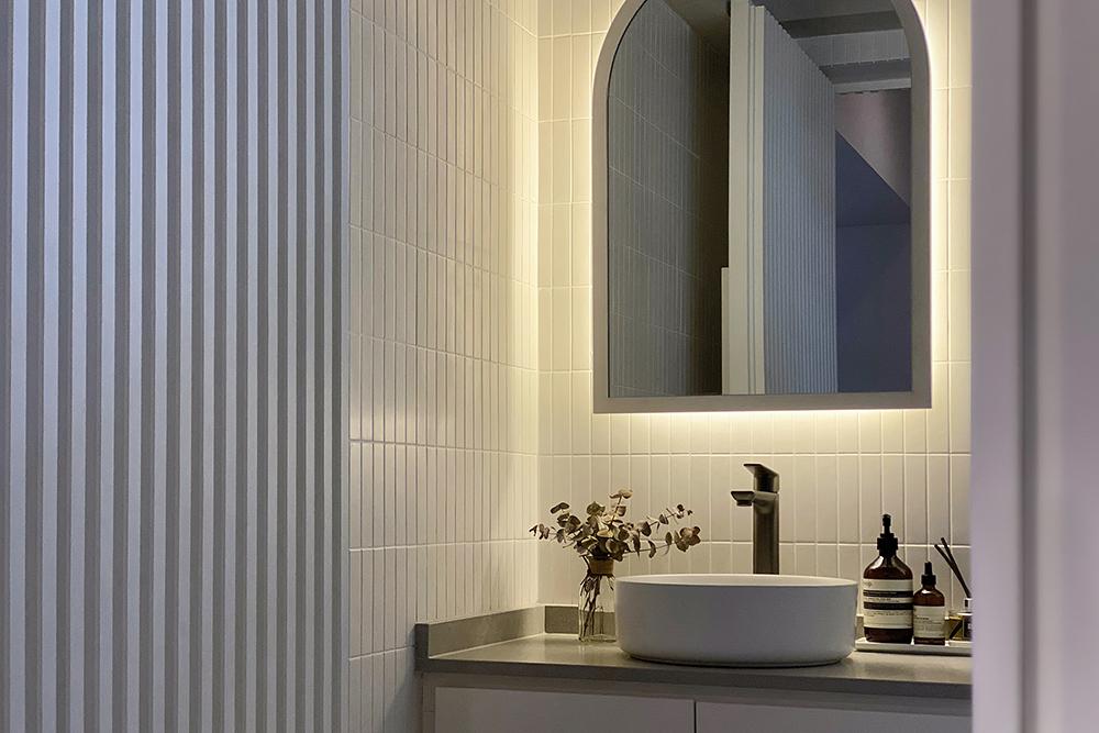 Scandinavian Bathroom with Homogeneous Tiles and Vanity Counter