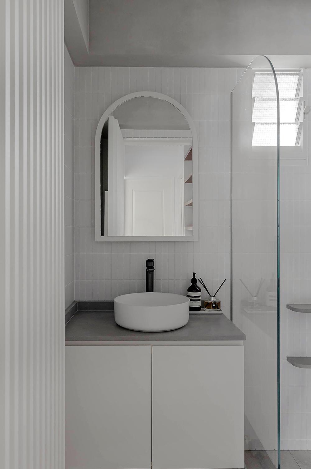 Scandinavian Bathroom with Homogeneous Tiles and Mirror