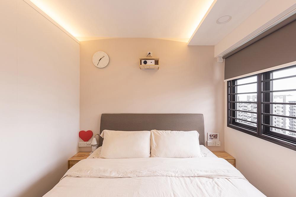 Industrial Bedroom with Cove Lighting and Paintings