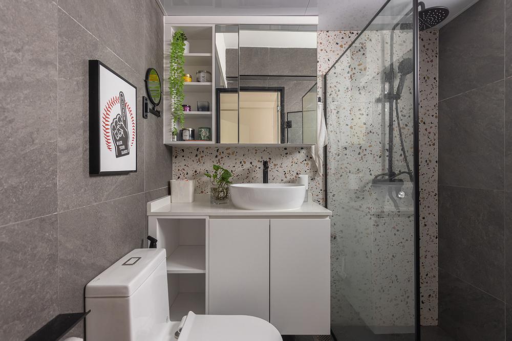 Industrial Bathroom with Homogeneous Tiles and Mirror