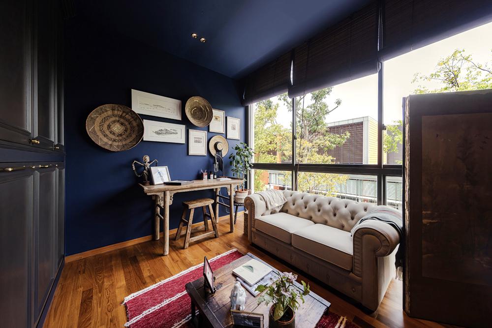 Eclectic Study with Artwork and Sofa