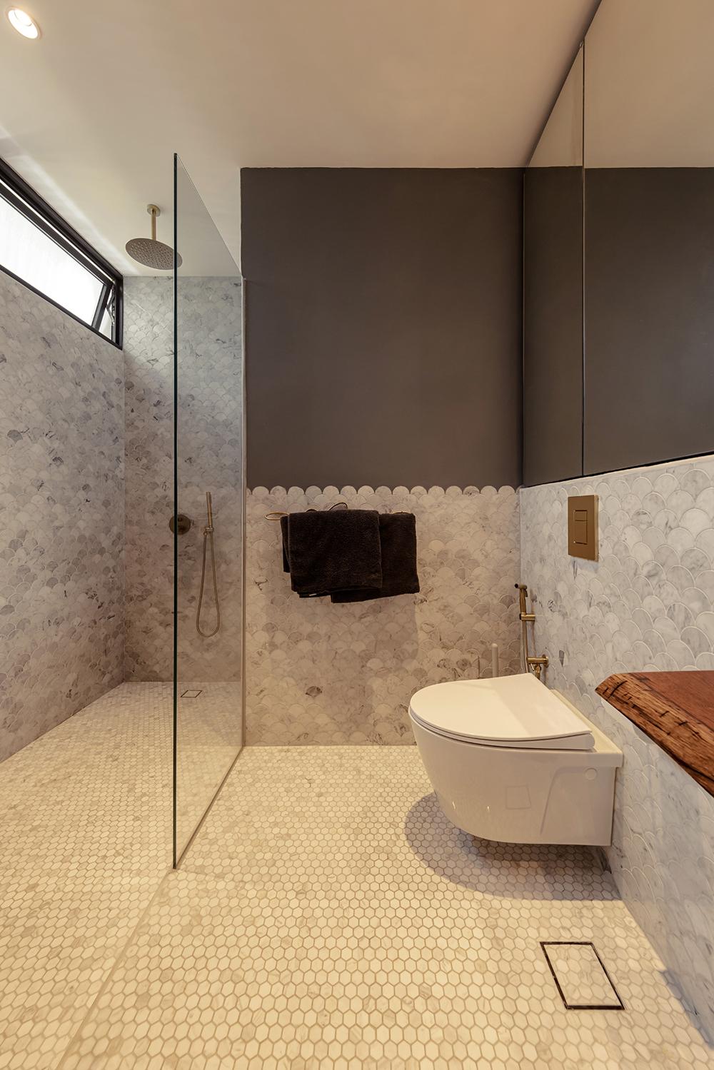 Eclectic Bathroom with Marble Floor and Mirror