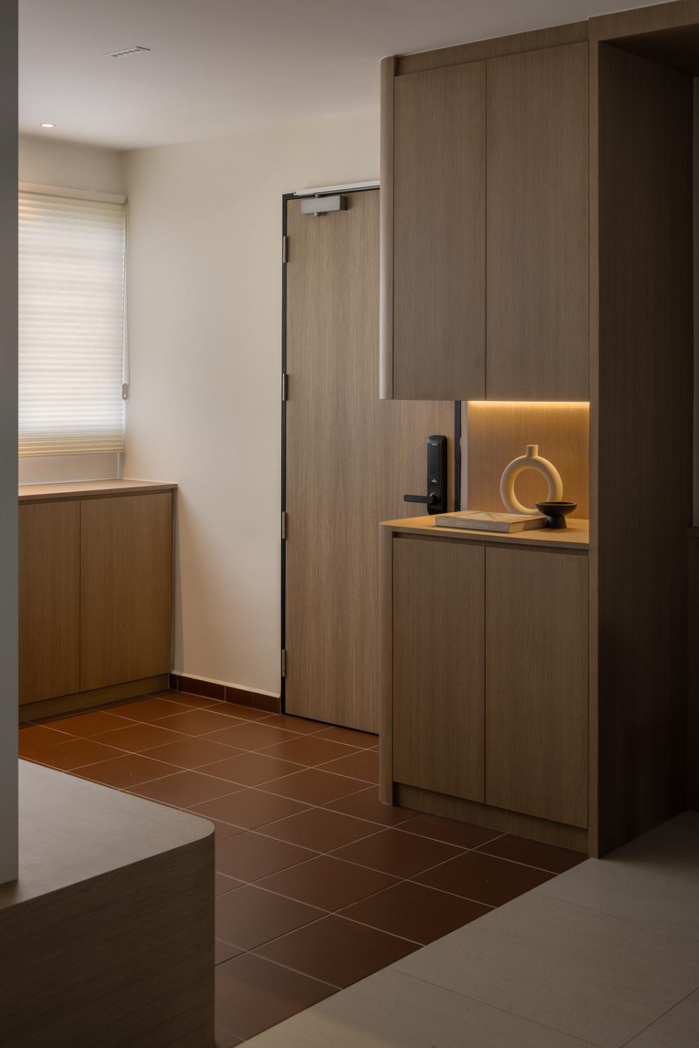 Asian Entryway with Homogeneous Tiles and Display Cabinets