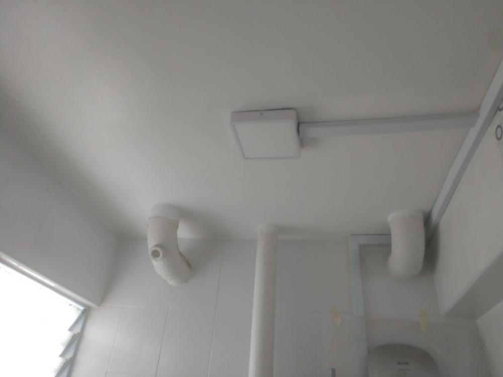 Asian Bathroom with Homogeneous Tiles and Bathroom Tap