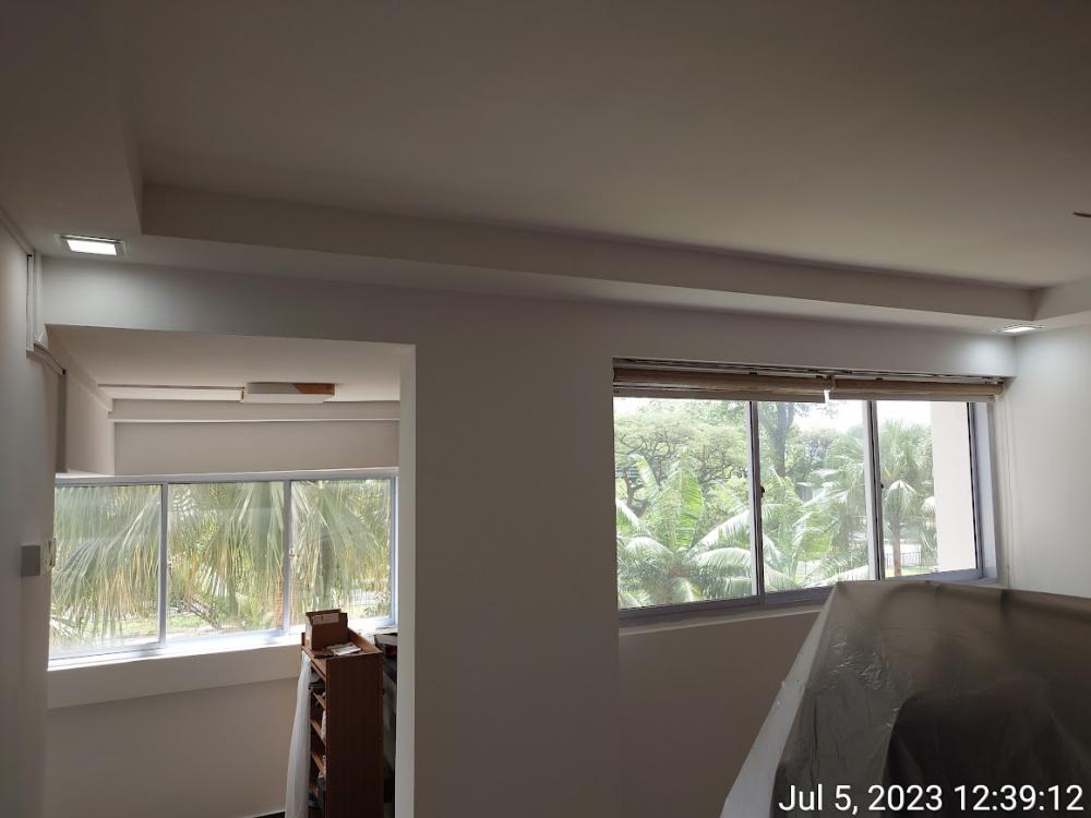 Asian Living Room with Homogeneous Tiles and Drop Ceiling
