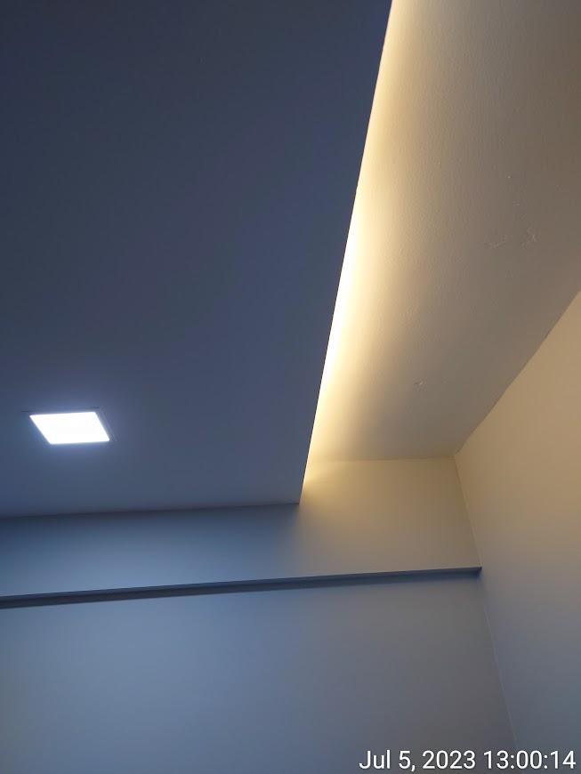 Asian Bedroom with Cove Lighting and Drop Ceiling