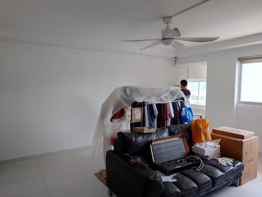 Asian Living Room with Homogeneous Tiles and TV Console