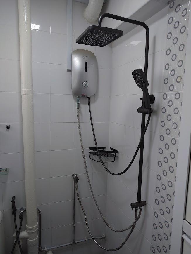 Asian Bathroom with Homogeneous Tiles and Mirror
