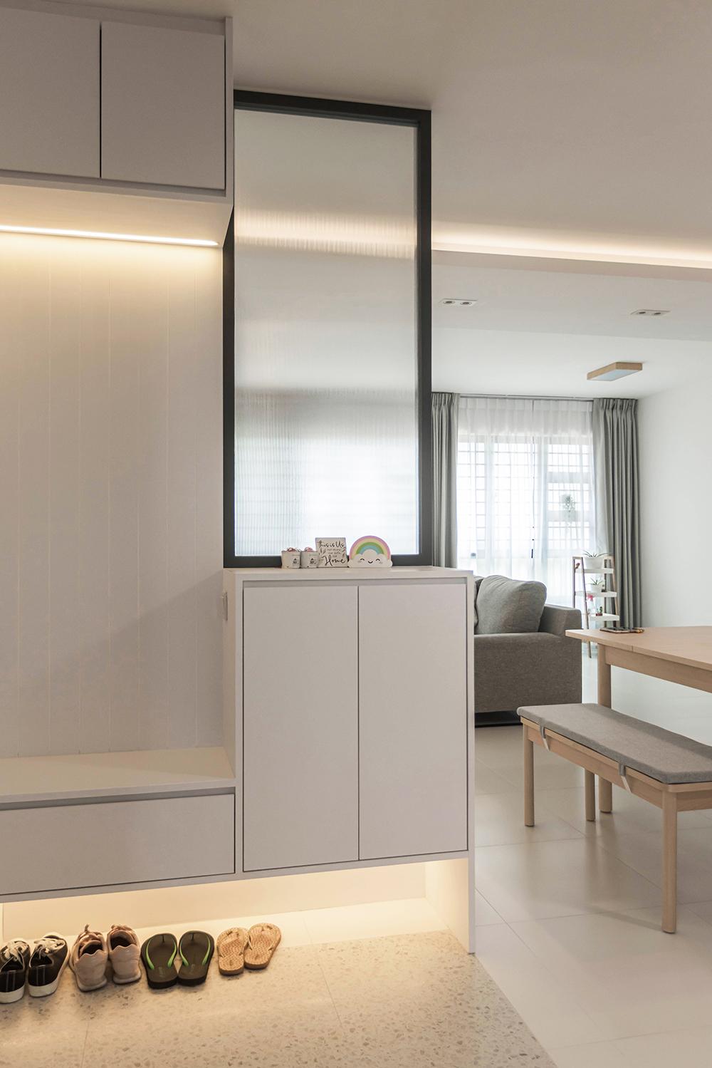 Modern Foyer with Cove Lighting and Storage Cabinets