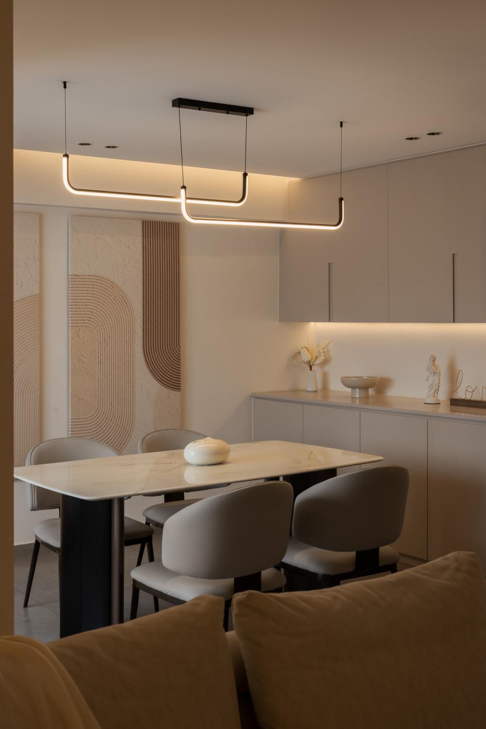 Modern Dining Room with Drop Light and Artwork