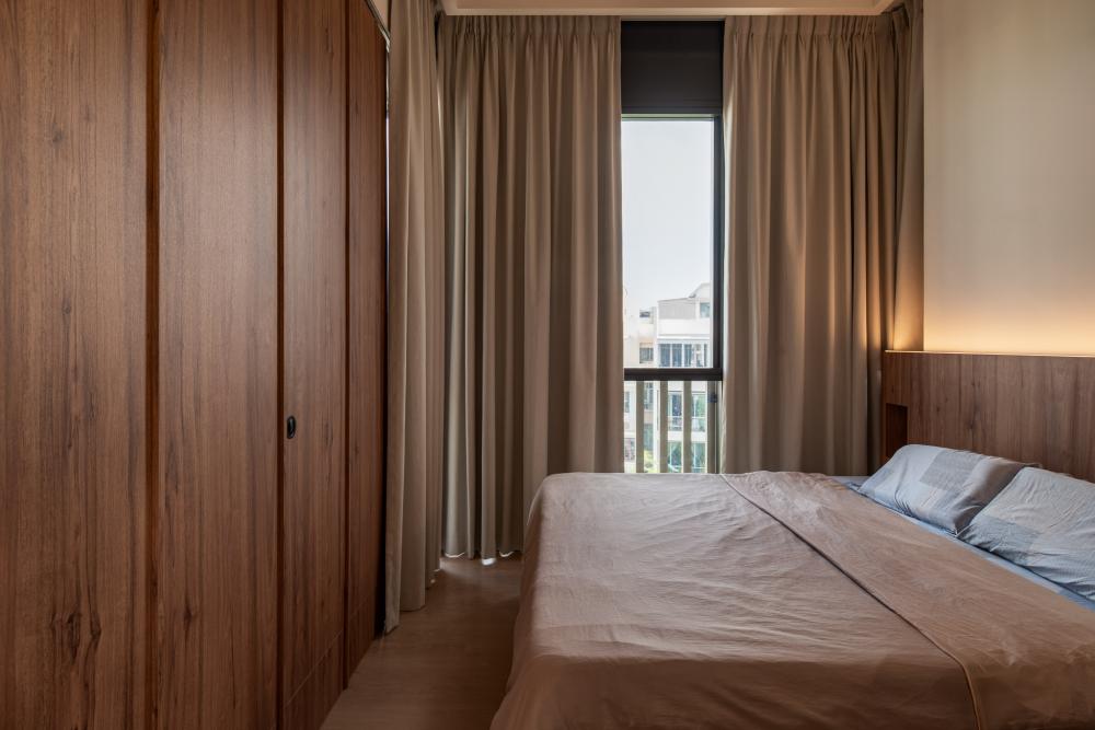 Modern Bedroom with Wood Flooring and Feature Wall