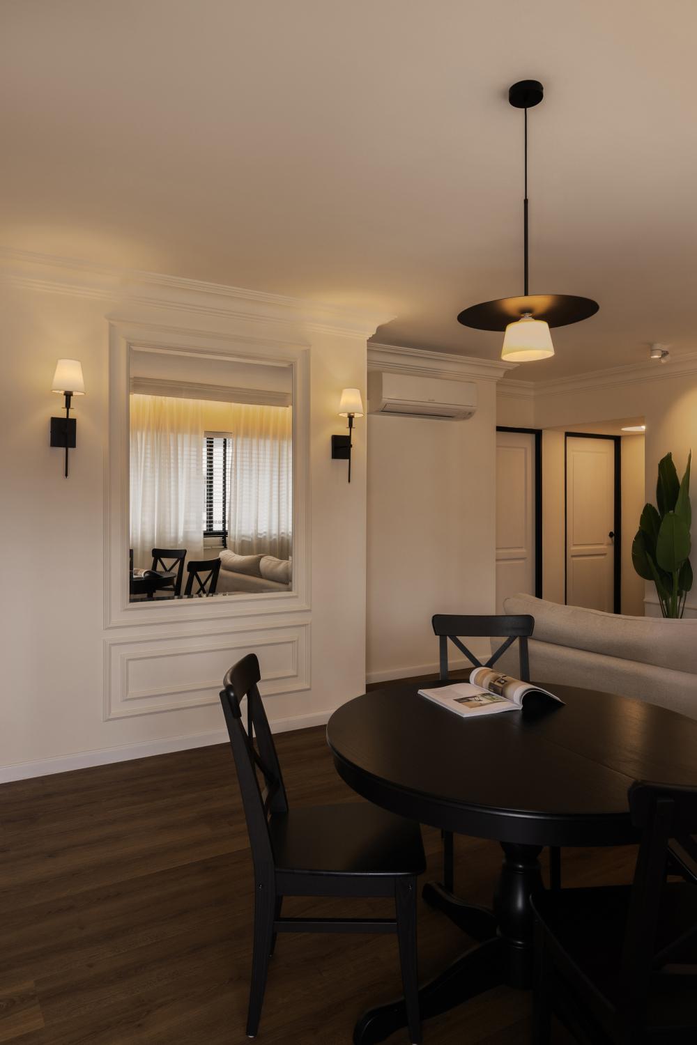 Country Dining Room with Wood Flooring and Drop Light