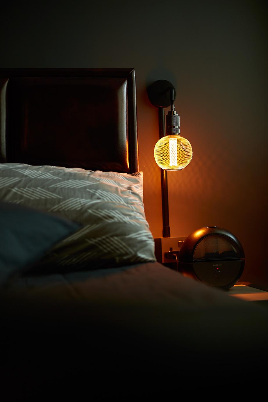 Industrial Bedroom with Bedside Table and Lighting