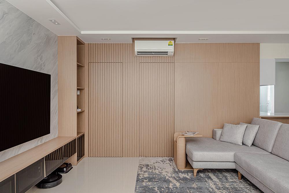 Scandinavian Living Room with Homogeneous Tiles and Feature Wall