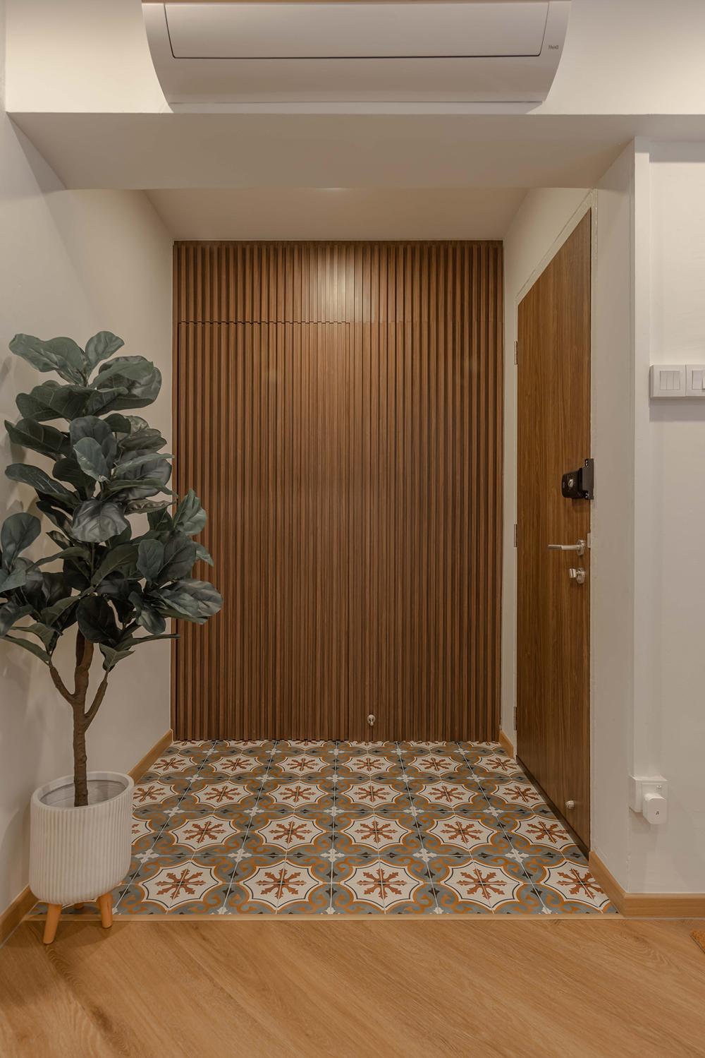 Transitional Foyer with Homogeneous Tiles and Storage Cabinets