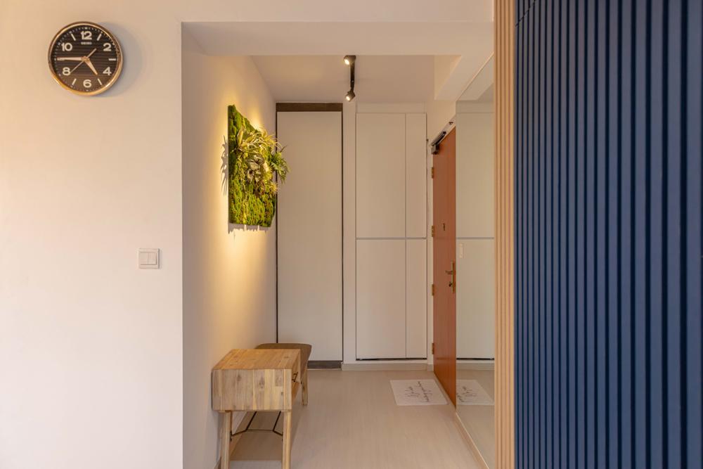 Modern Foyer with Vinyl Flooring and Feature Wall