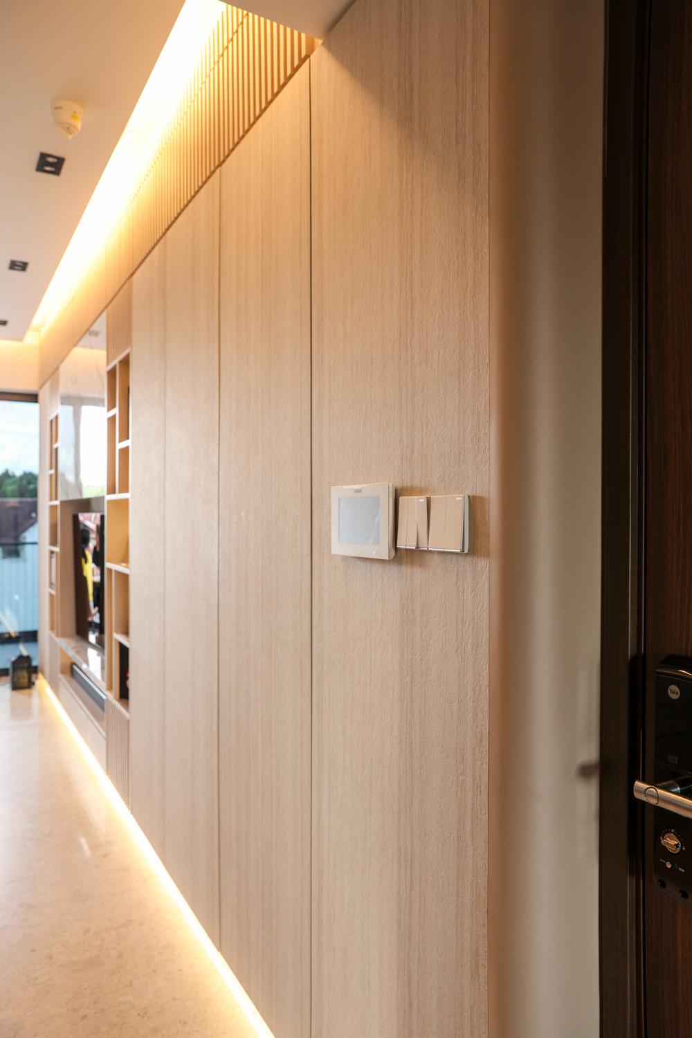 Modern Foyer with Cove Lighting and Storage Cabinets