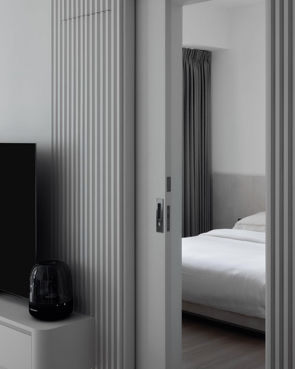 Minimalist Bedroom with Wood Flooring and Drop Ceiling