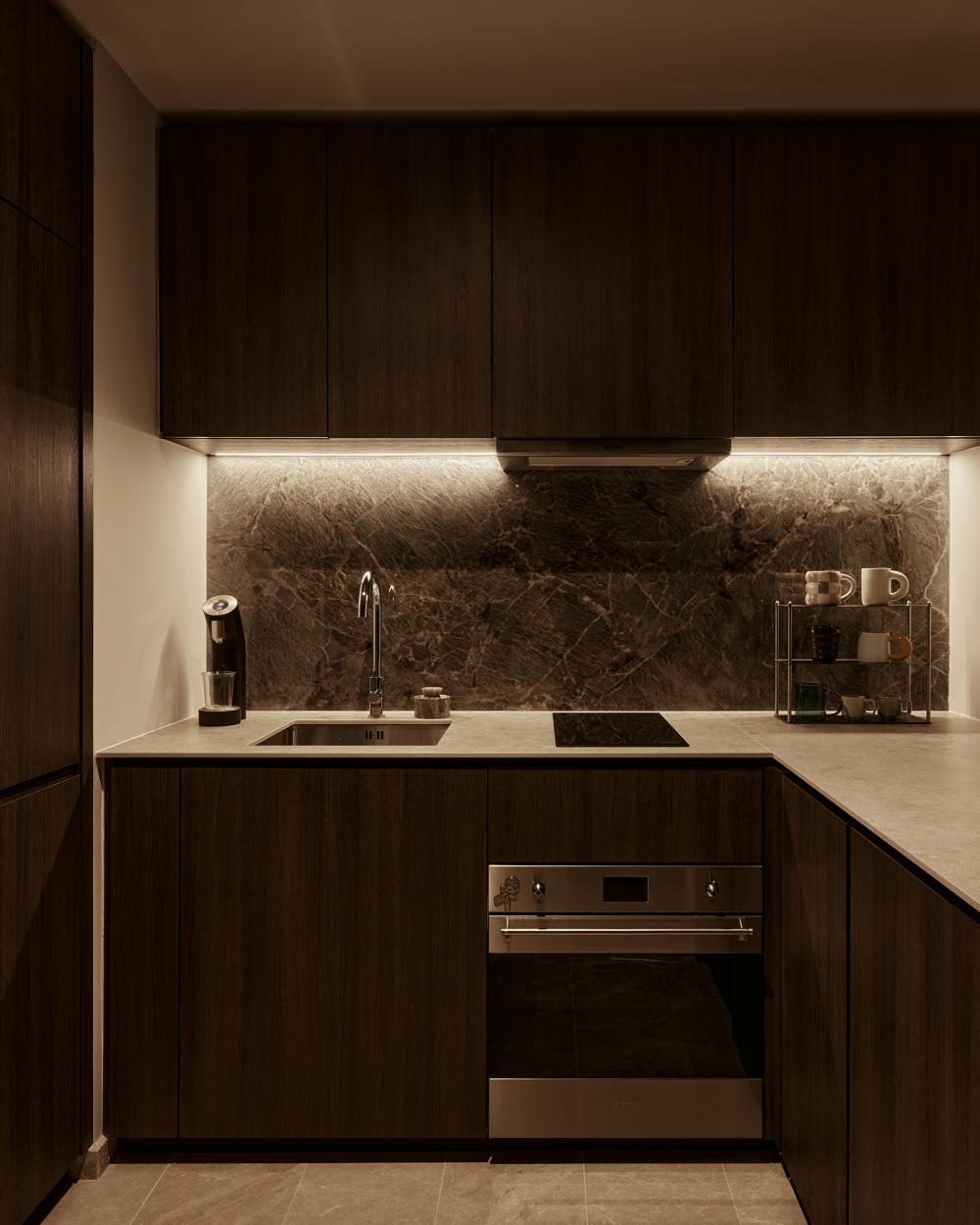 Contemporary Kitchen with Herringbone Tiling and Wood Flooring