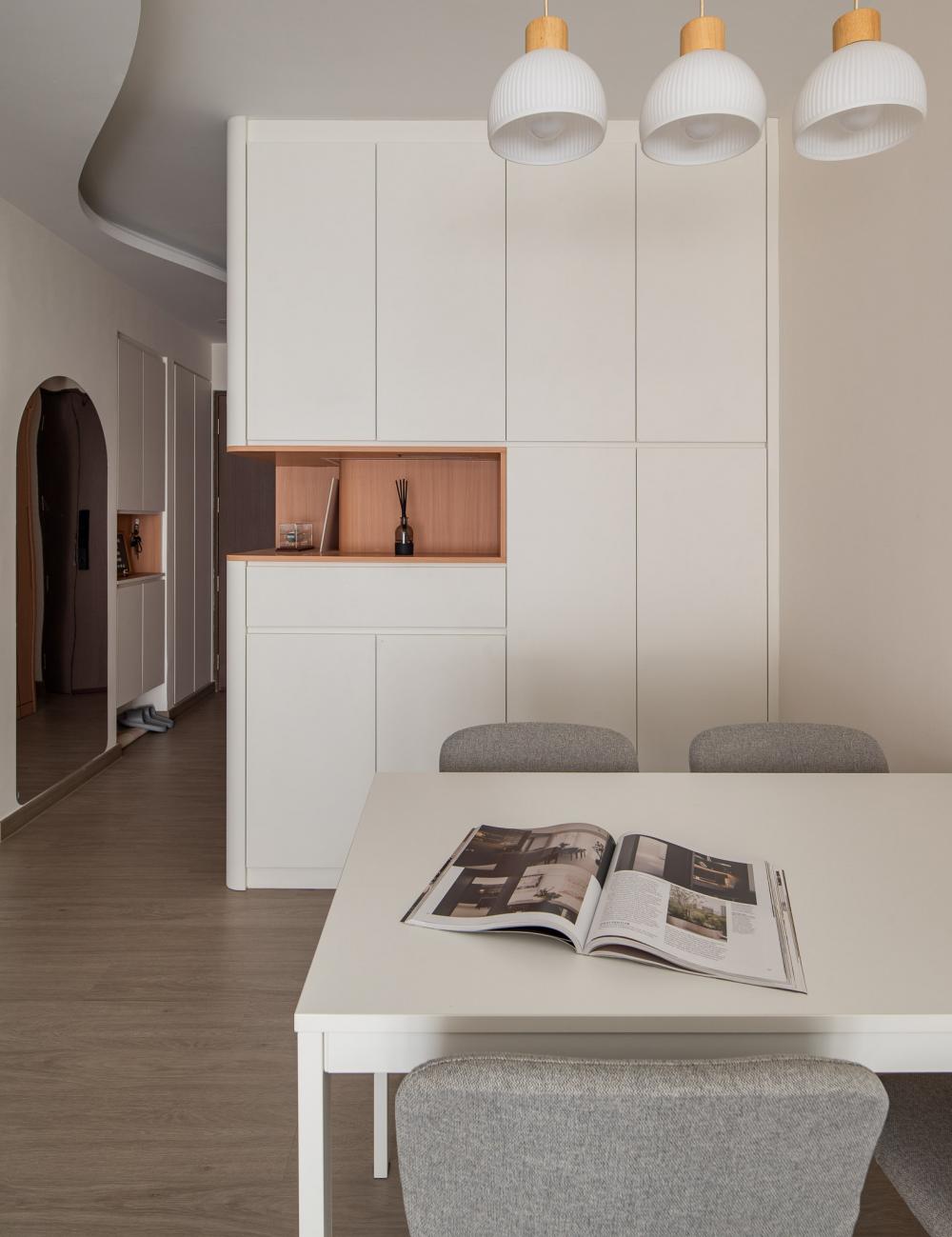 Minimalist Dining Room with Cove Lighting and Dining Table