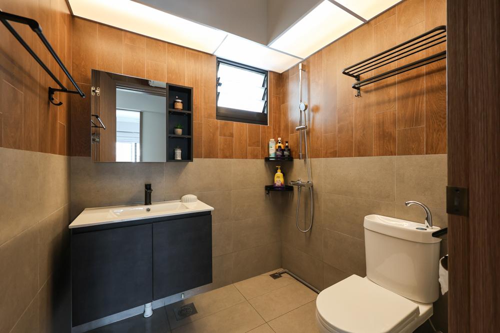 Industrial Bathroom with Homogeneous Tiles and Mirror