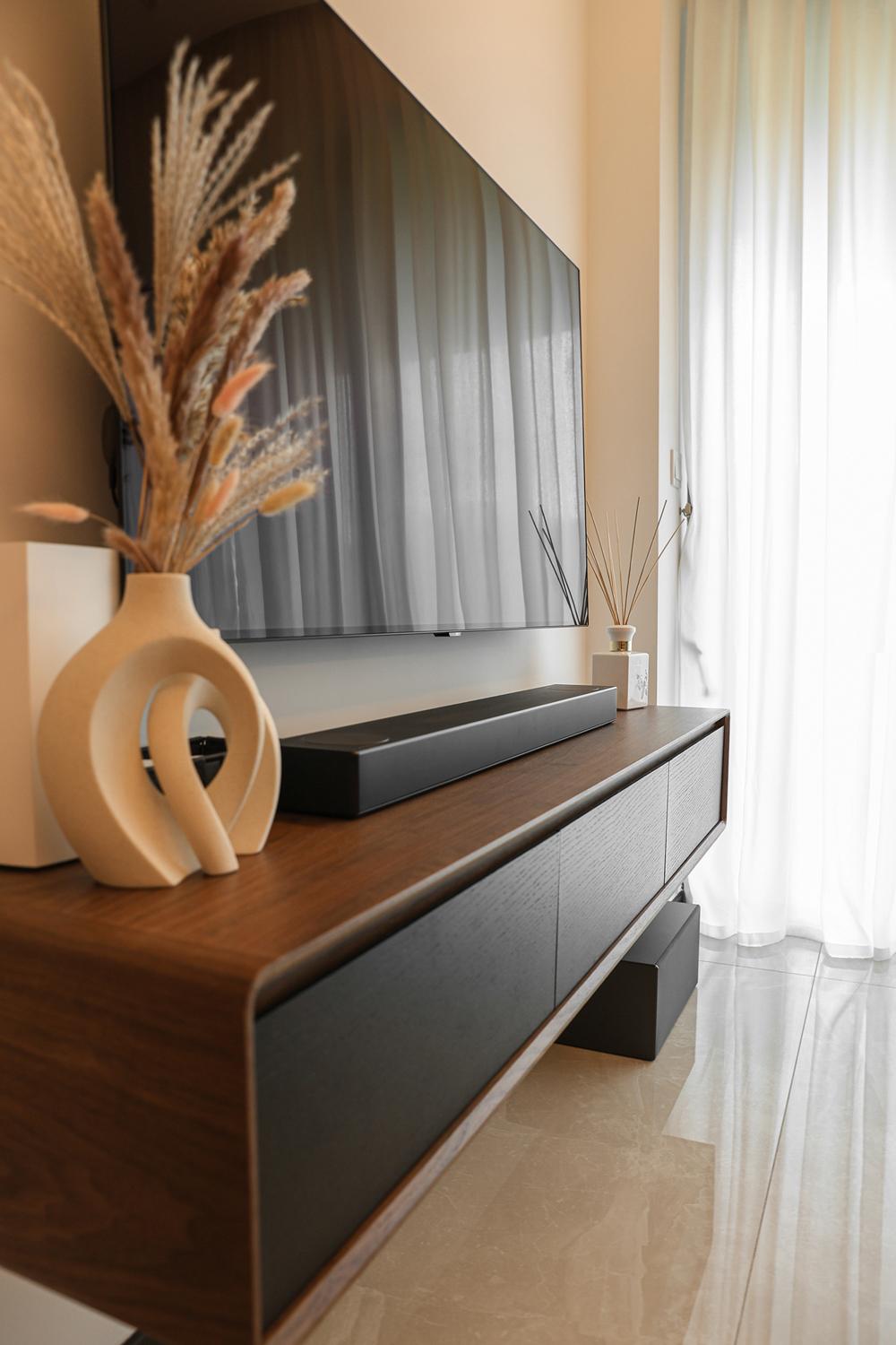 Modern Living Room with TV Console and Paintings