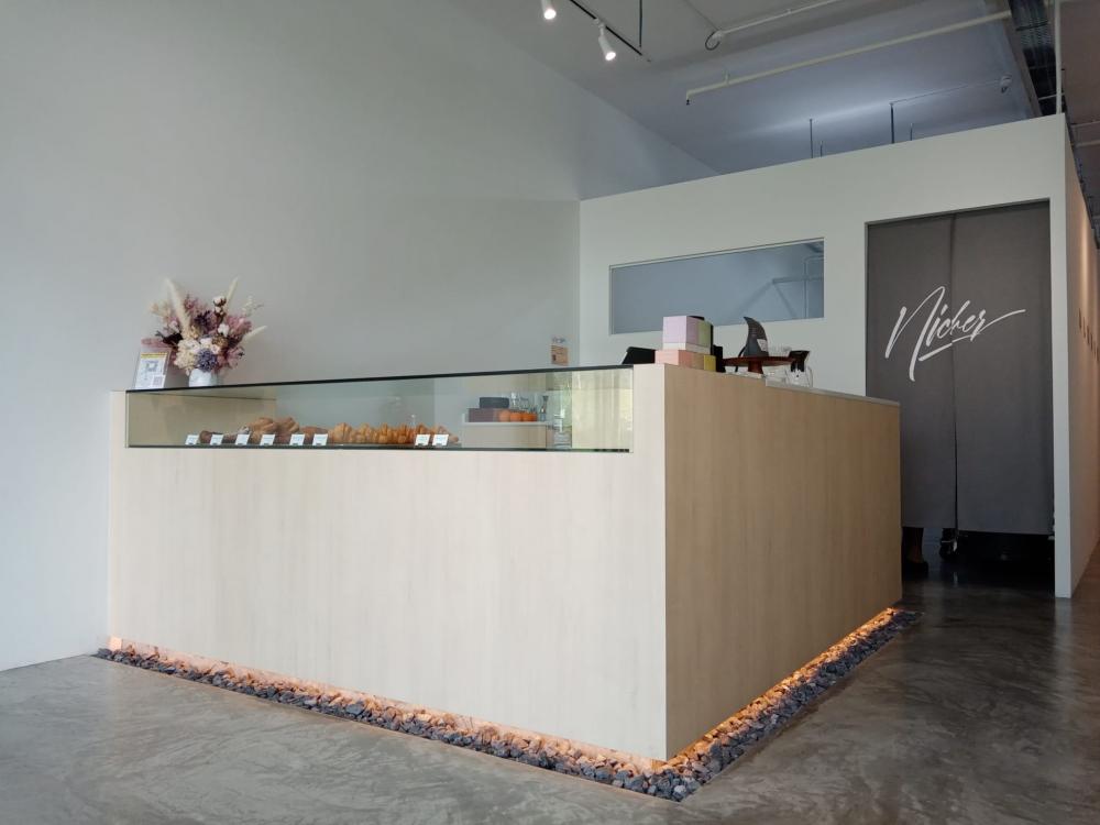 Minimalist Retail with Cement Floor and Bakeware