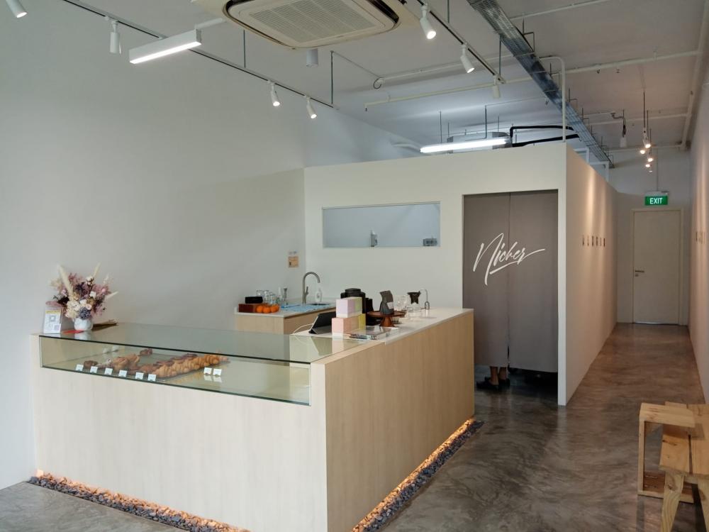 Minimalist Retail with Cement Floor and Bakeware
