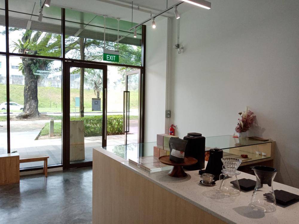 Minimalist Retail with Cement Floor and Window Seat