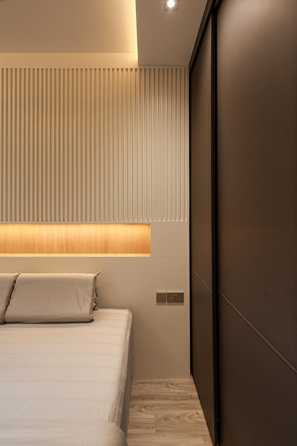 Minimalist Bedroom with Vinyl Flooring and Feature Wall