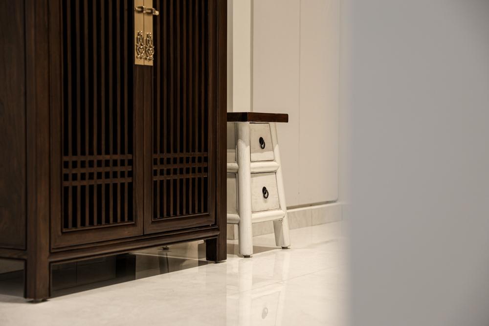 Eclectic Foyer with Homogeneous Tiles and Shoe Cabinets