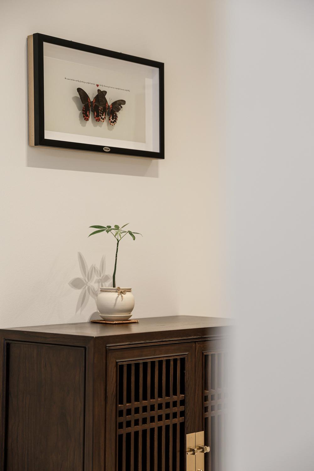 Eclectic Foyer with Artwork and Shoe Cabinets