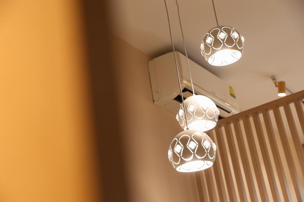 Scandinavian Dining Room with Feature Wall and Lighting