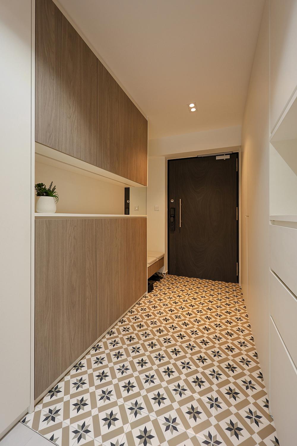 Minimalist Foyer with Homogeneous Tiles and Storage Cabinets
