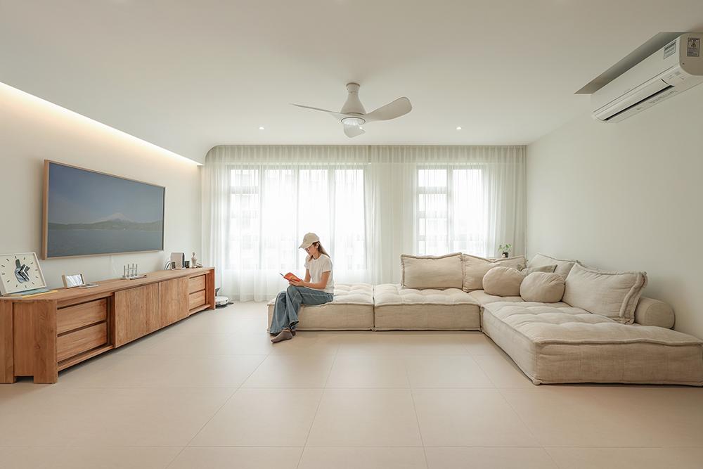 Minimalist Living Room with Homogeneous Tiles and Cove Lighting