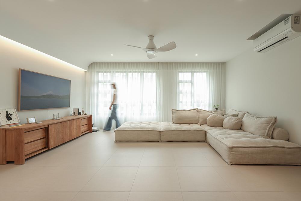 Minimalist Living Room with Homogeneous Tiles and Cove Lighting