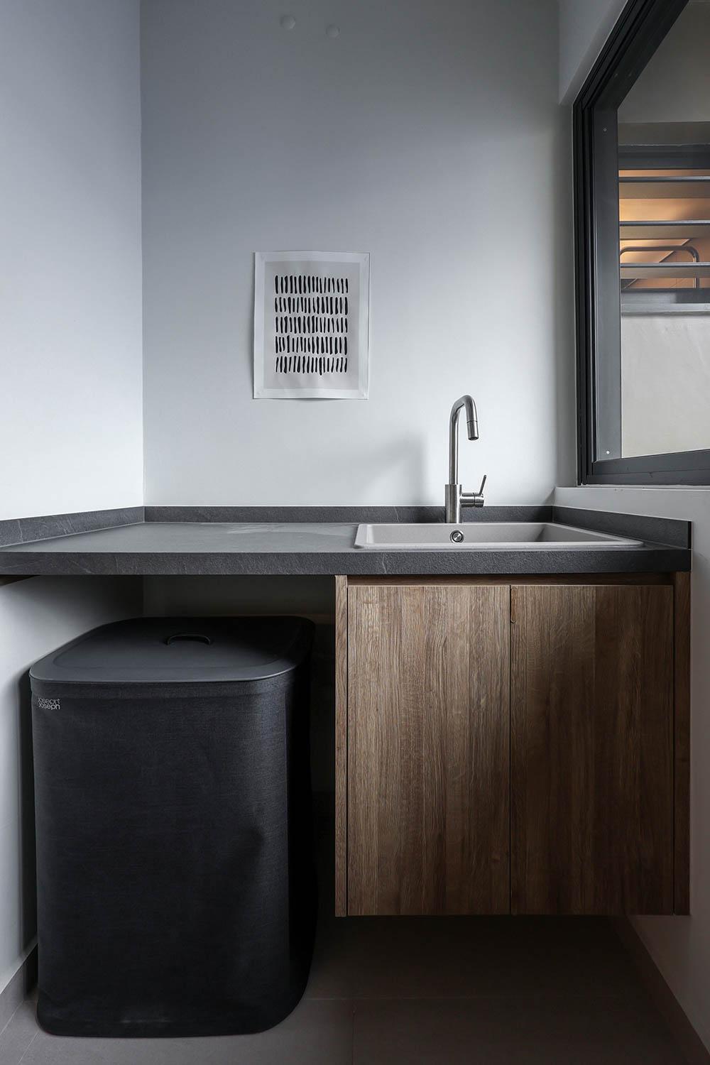 Minimalist Service Yard with Countertop and Laundry Area