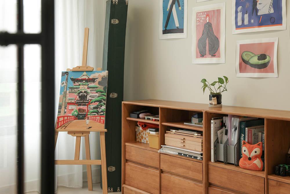 Minimalist Study with Bookshelf and Artwork