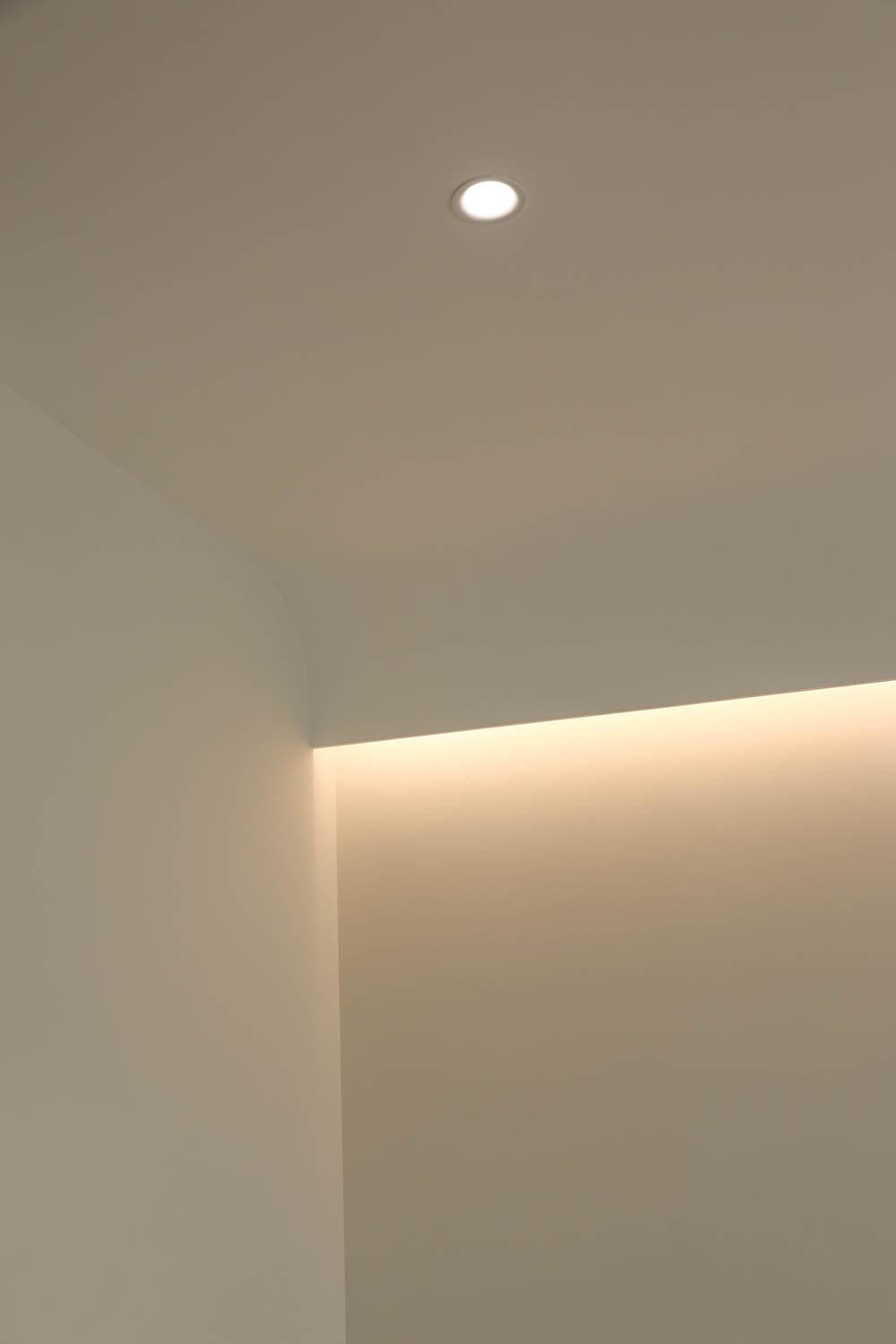 Minimalist Living Room with Cove Lighting and Lighting