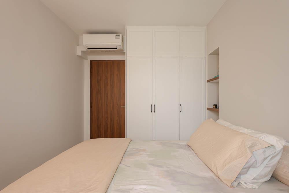 Modern Bedroom with Wardrobe and Paintings