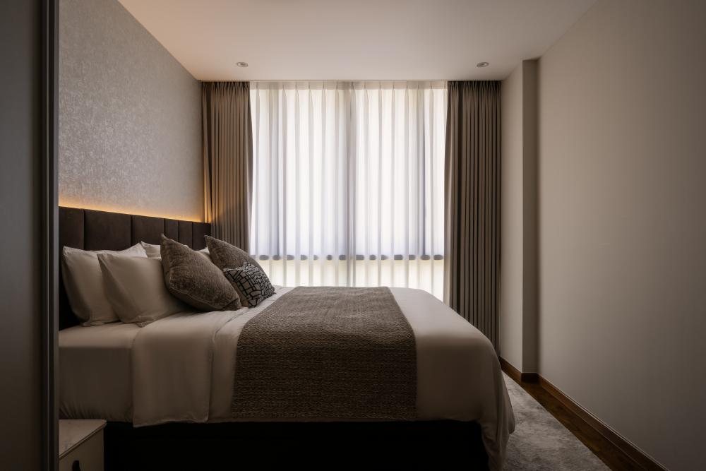 Contemporary Bedroom with Cove Lighting and Curtain