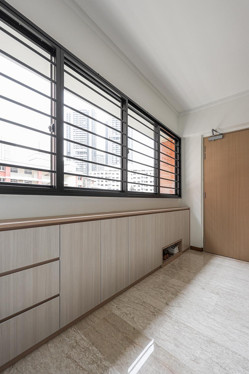 Scandinavian Foyer with Homogeneous Tiles and Shoe Cabinets