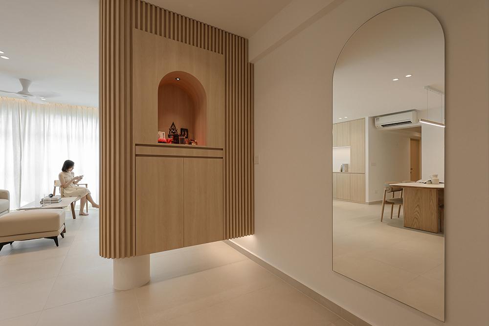 Minimalist Foyer with Homogeneous Tiles and Mirror