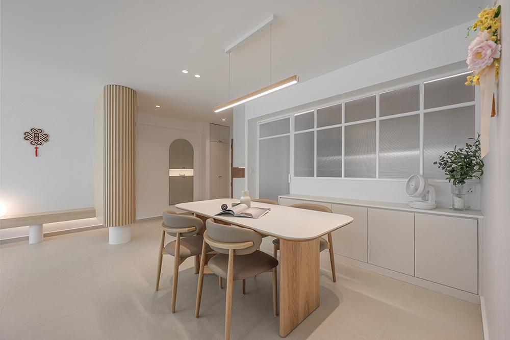 Minimalist Dining Room with Glass Door and Storage Cabinets