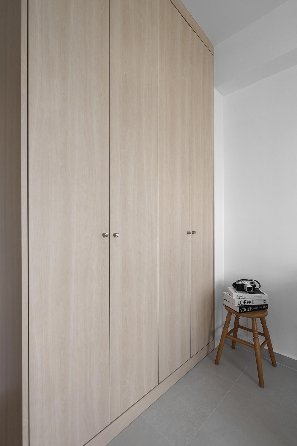 Minimalist Bedroom with Homogeneous Tiles and Wardrobe