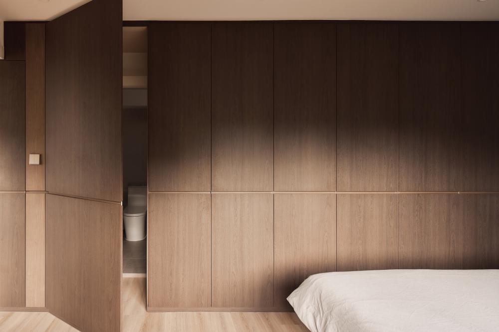Contemporary Bedroom with Wood Flooring and Feature Wall