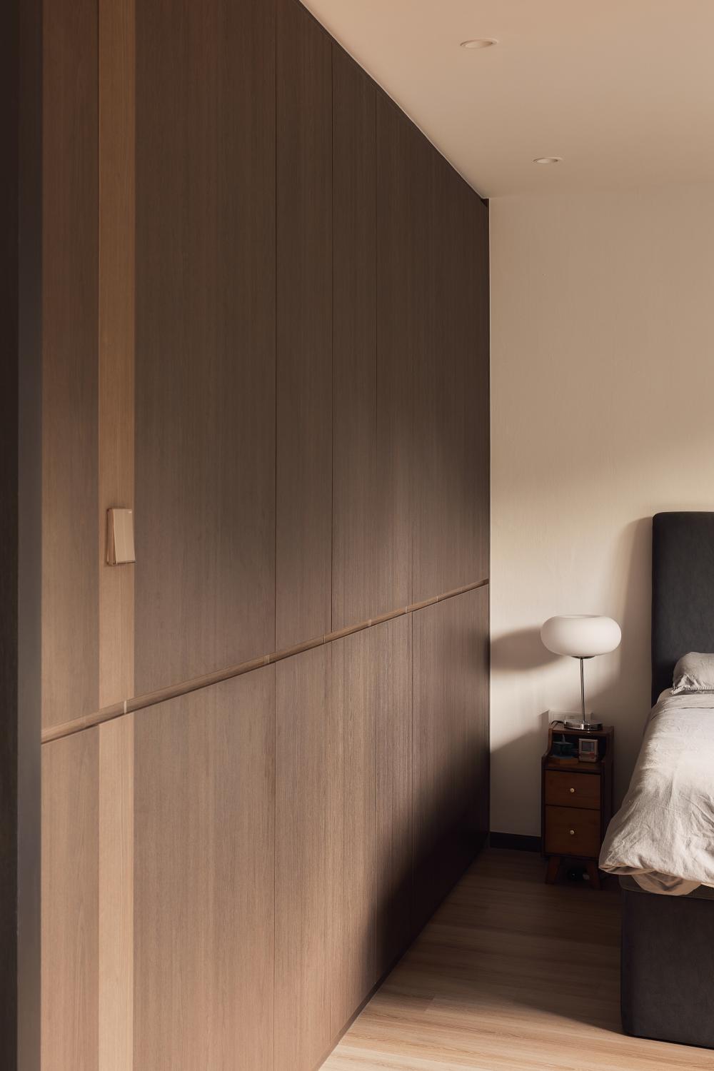 Contemporary Bedroom with Wood Flooring and Feature Wall