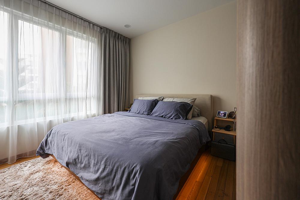 Scandinavian Bedroom with Parquet Floor and Paintings